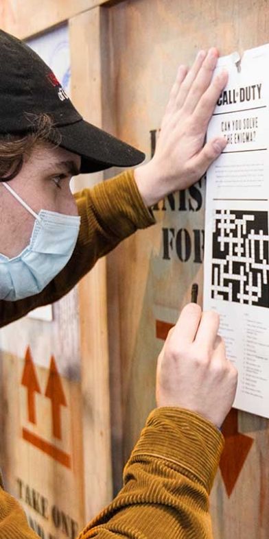 People working on solving puzzle