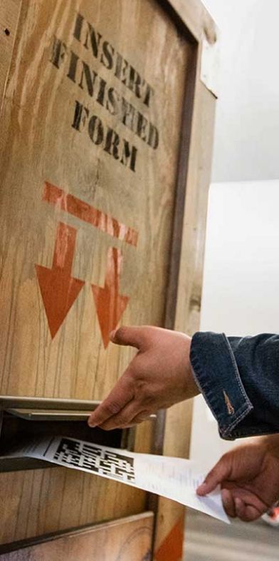 People working on solving puzzle