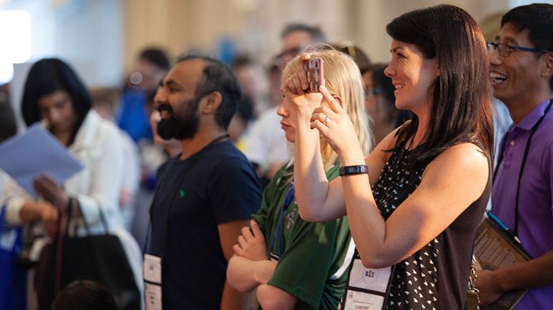 crowd cheers and smiles